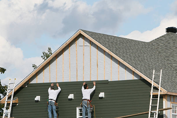 Professional Storm Damage Siding Repair technician working in Wyano, PA